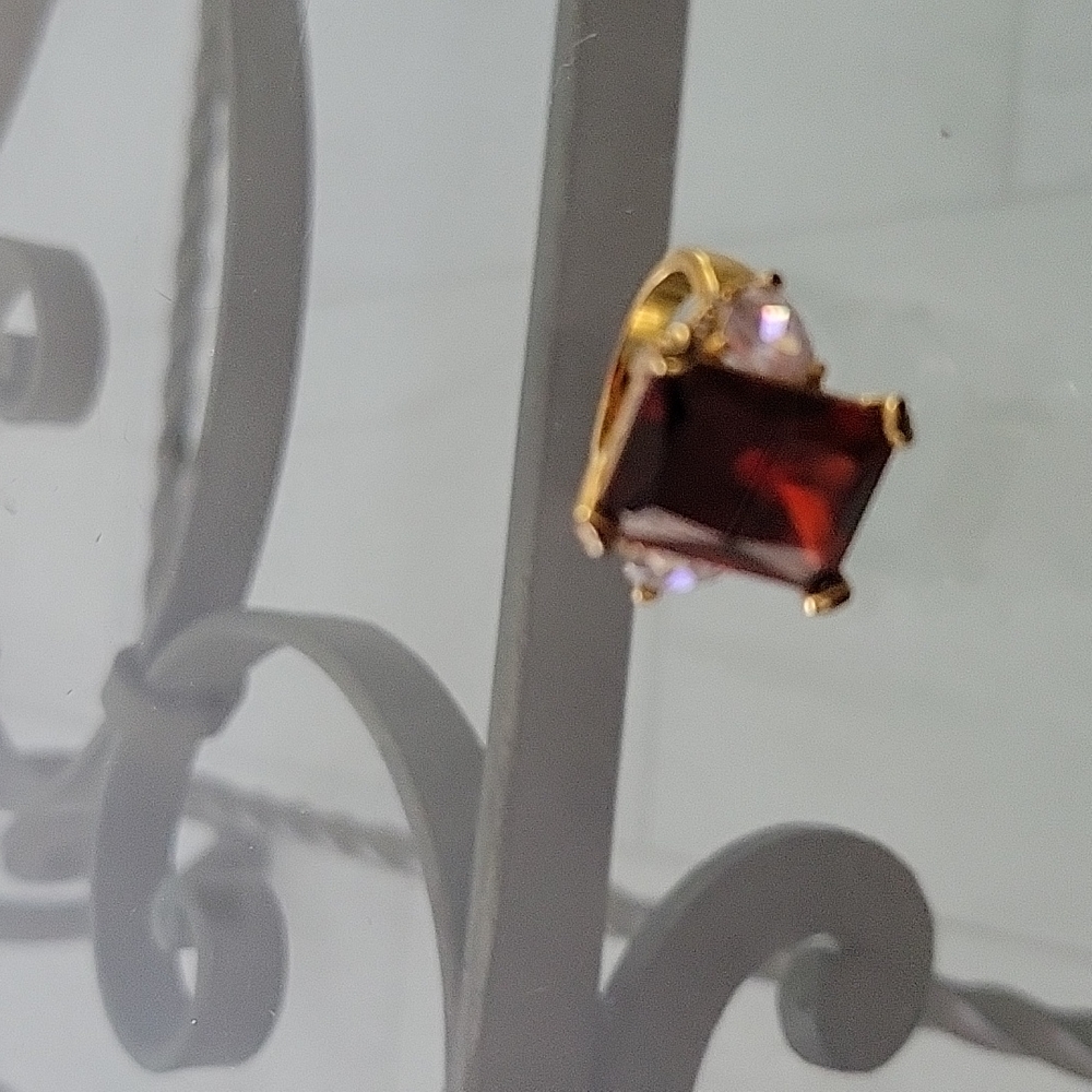 Imitation garnet , emerald cut cocktail ring.